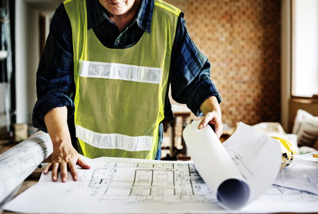 architecture working on a blueprint